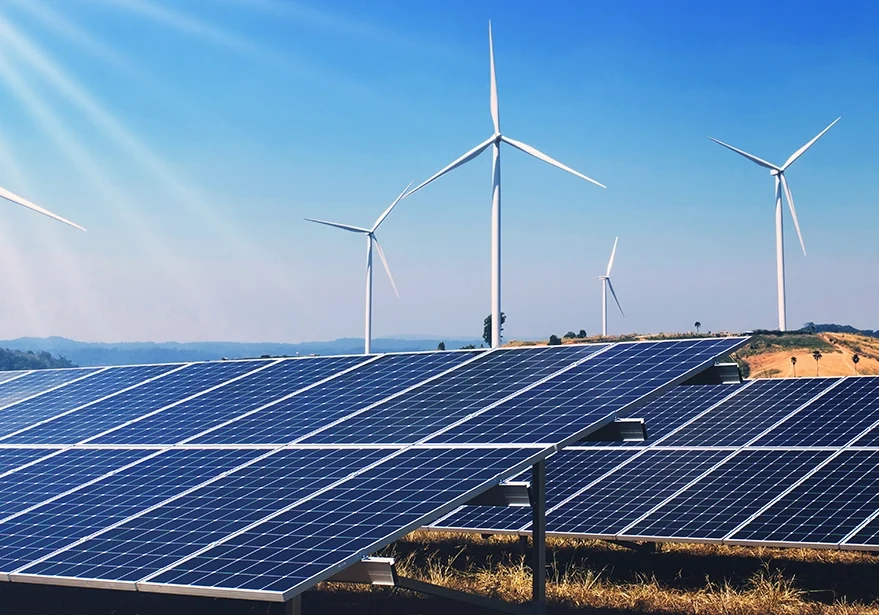 Clean energy power in nature. solar panels and wind turbines on hill.